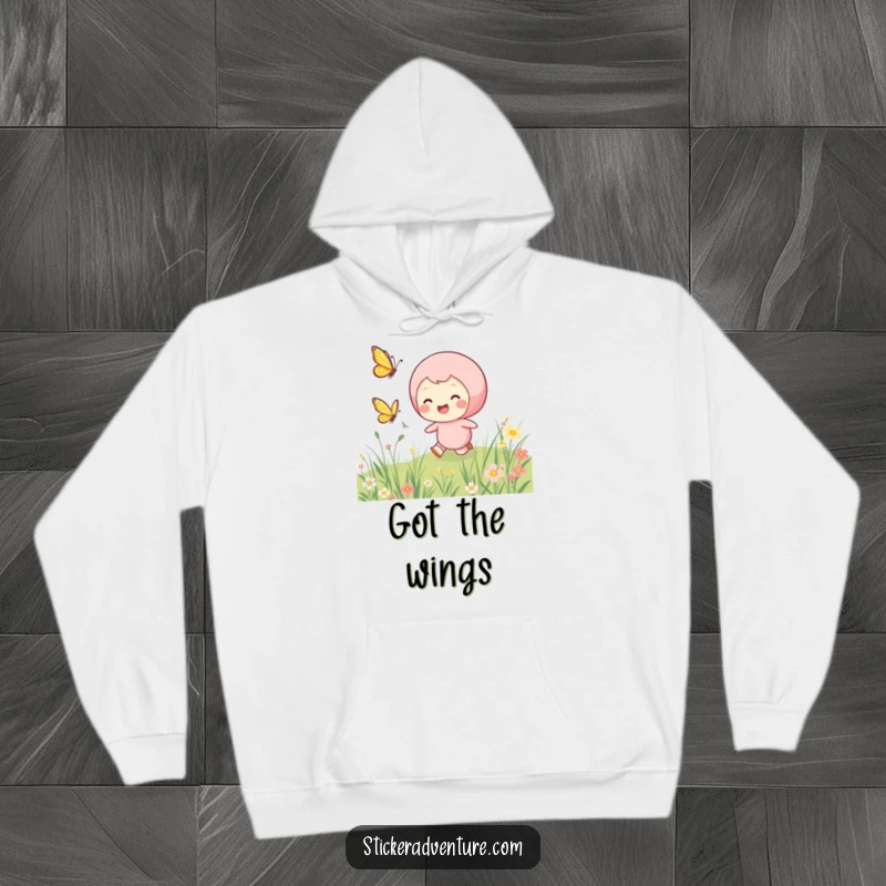Funny chasing butterfly hoodie, depicting a smiling character joyfully chasing a fluttering butterfly through a beautiful meadow.