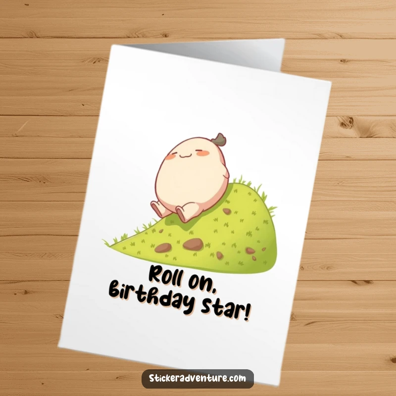 Funny Free Printable Birthday Card: A plump character joyfully tumbles down a green hill, embodying the spirit of fun.